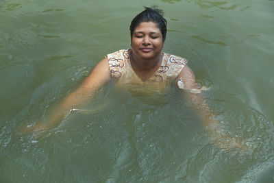 High angle view of woman swimming in pool