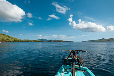 The front part of a boat in the open sea