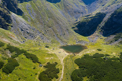 Aerial drone point of view of iezer lake, rodnei mountains, eastern carpathians, romania