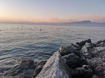 Scenic view of sea against sky during sunset