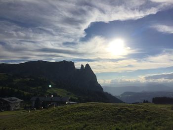 Scenic view of landscape against cloudy sky