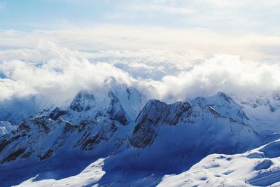 Scenic view of snowcapped mountains against sky