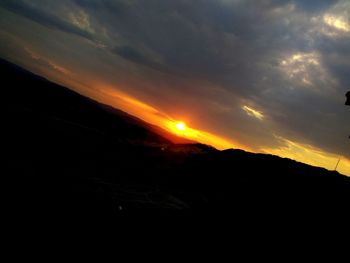 Low angle view of dramatic sky during sunset