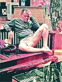 Midsection of man sitting on swimming pool