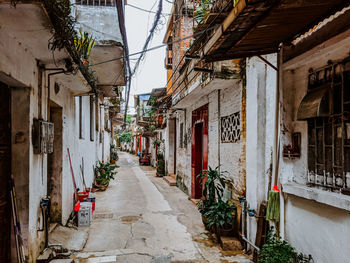 Narrow alley amidst buildings in city