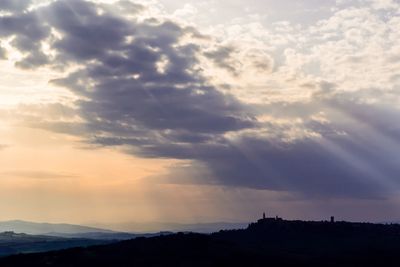 Scenic view of mountains against sky at sunset