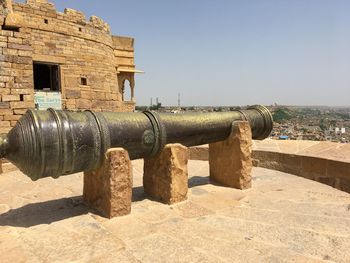 Cannon in fort against sky on sunny day