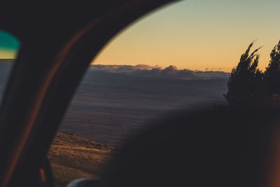 Scenic view of sea seen through silhouette window