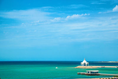 Scenic view of sea against blue sky