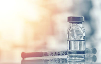 Close-up of glass bottle on table