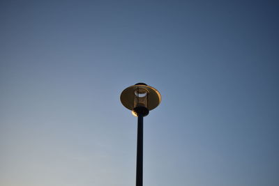 Low angle view of street light against clear sky