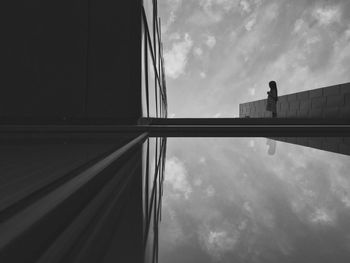 Low angle view of built structure against cloudy sky