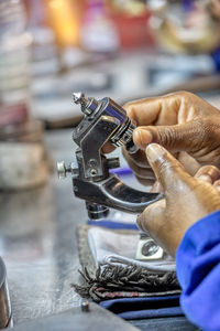 Close-up of man working at machine