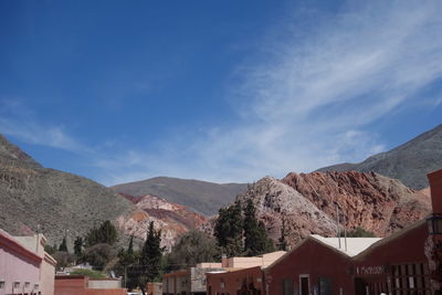 Houses in town against sky