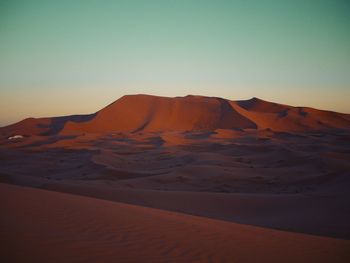 Scenic view of desert against clear sky