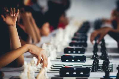 Close-up of hands playing chess
