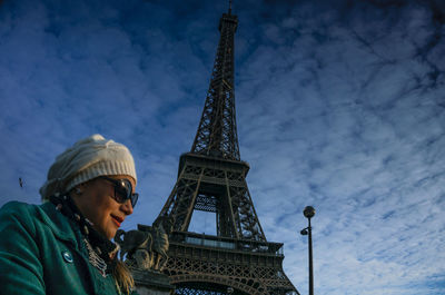 Silhouette of woman standing against sky