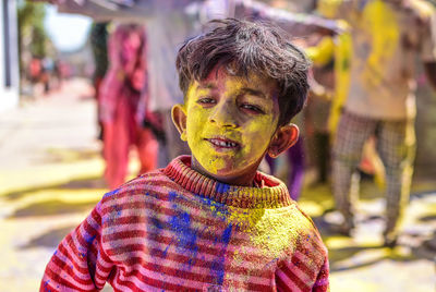 Close-up of boy covered in powder paint