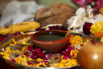 Close-up of various flowers in bowl on table