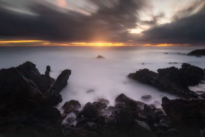 Scenic view of sea against sky during sunset