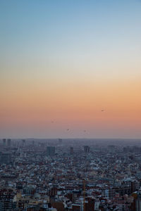 High angle view of buildings against sky during sunset