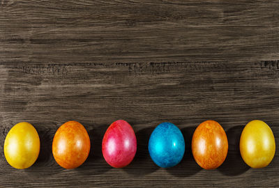 Close-up of multi colored eggs on table