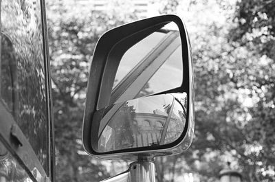 Close-up of vintage car on road
