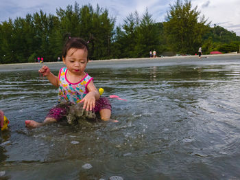 Cute girl enjoying in water