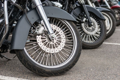 Close-up of motorcycle parked on road