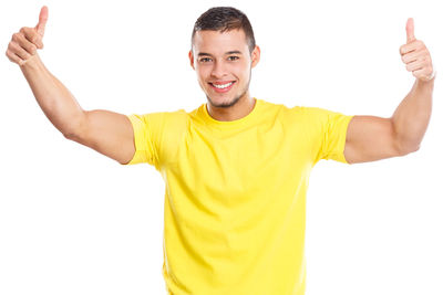 Portrait of smiling man standing against white background