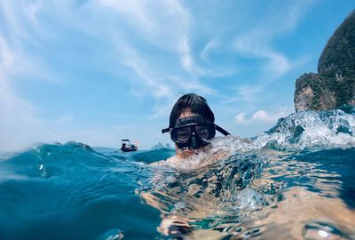 Portrait of man swimming in sea