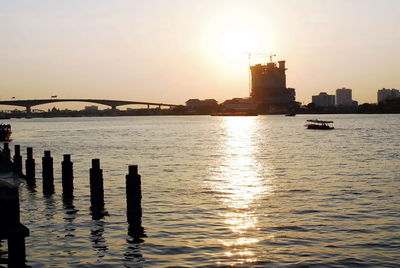 Scenic view of river against sky during sunset