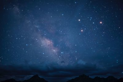 Scenic view of star field against sky at night