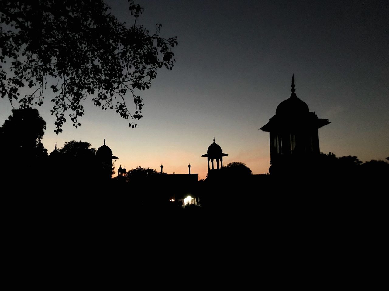 SILHOUETTE OF CATHEDRAL AGAINST SKY DURING SUNSET