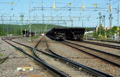 Train on railroad track against sky