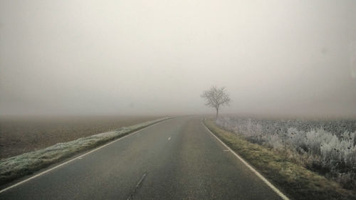 Empty road in foggy weather