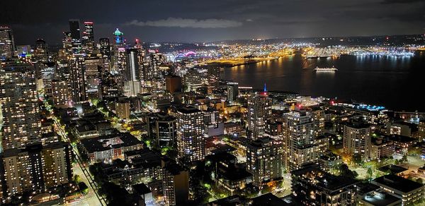 High angle view of illuminated city buildings at night