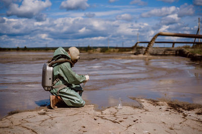 Rear view of boy on beach