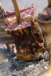 Close-up of meat on barbecue