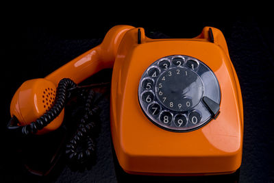 High angle view of telephone booth against black background