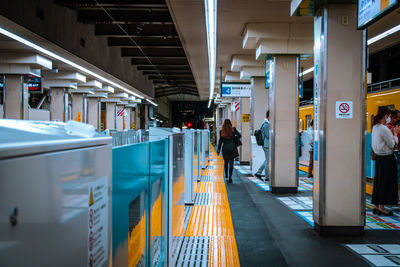 People at railroad station platform