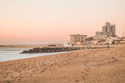 Scenic view of beach against sky during sunset