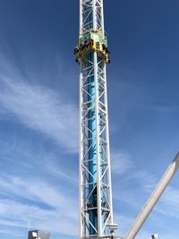 Low angle view of communications tower against sky