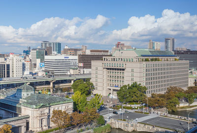 Buildings in city against sky