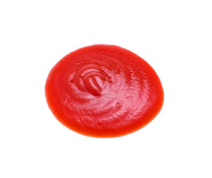 Close-up of tomato sauce over white background