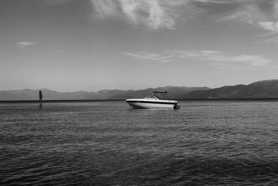 Boat sailing in sea against sky