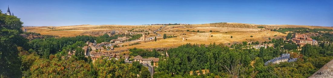 Scenic view of landscape against clear blue sky