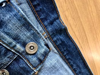 Close-up of jeans on table