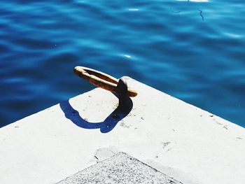 High angle view of metal chain on lake