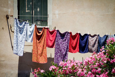 Clothes drying against wall